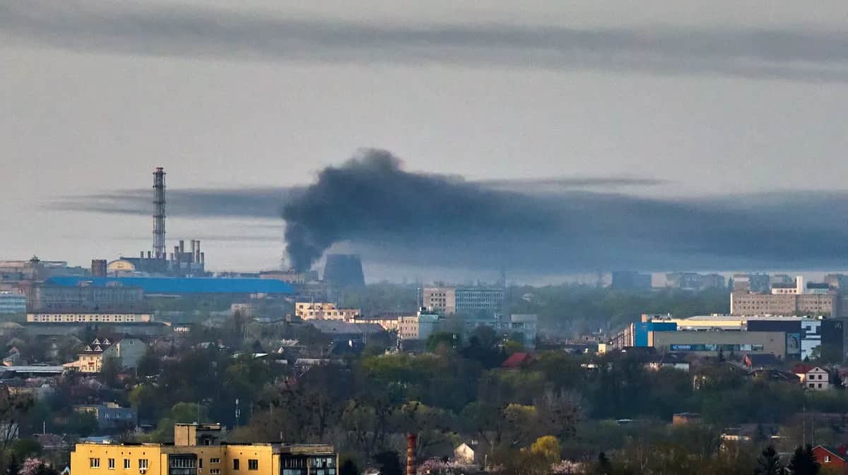A cloud of smoke rises above Ukraine's second city Kharkiv following a missile attack, 11 April 2024. Photo: EPA-EFE / SERGEY KOZLOV
