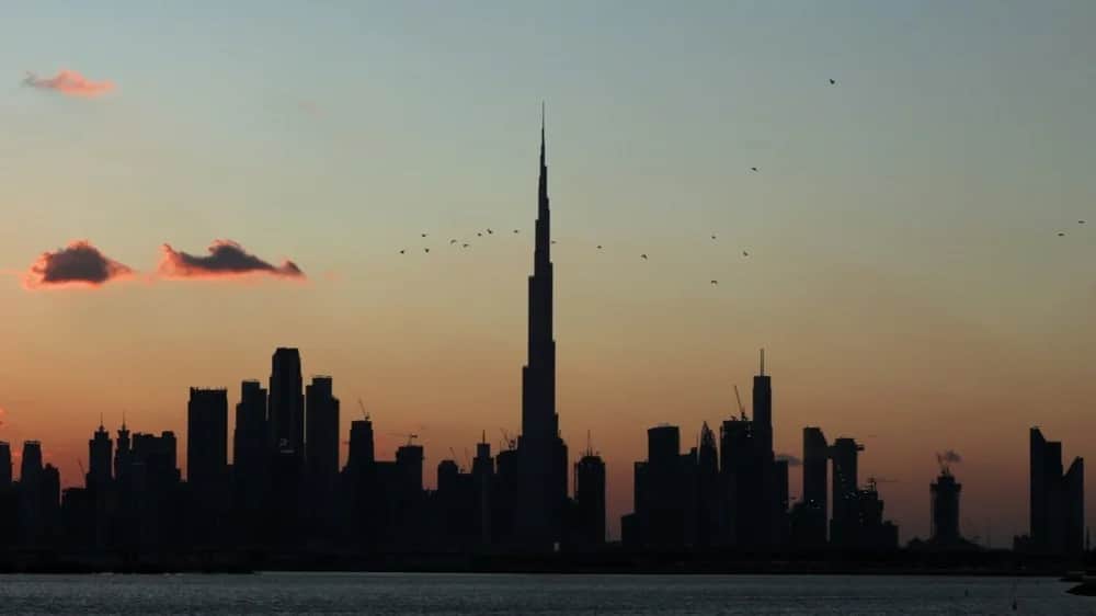 The sun sets behind the Dubai skyline, United Arab Emirates, 12 January 2020. Photo: EPA-EFE / ALI HAIDER