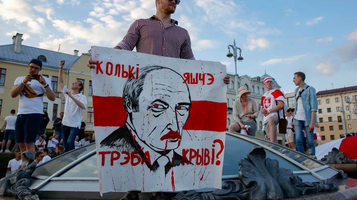 A protester in Minsk holds up a sign reading “How much more blood must be spilt?” during mass demonstrations against the stolen presidential election in Belarus, 16 August 2020. Photo: EPA-EFE / TATYANA ZENKOVICH