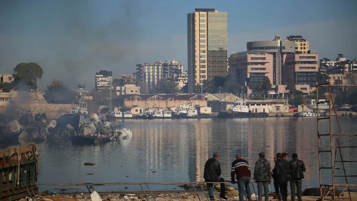 Locals gather to look at damage done to the port of Latakia following a reported Israeli airstrike on the city in western Syria, 10 December 2024. Photo: EPA-EFE / BILAL AL HAMMOUD