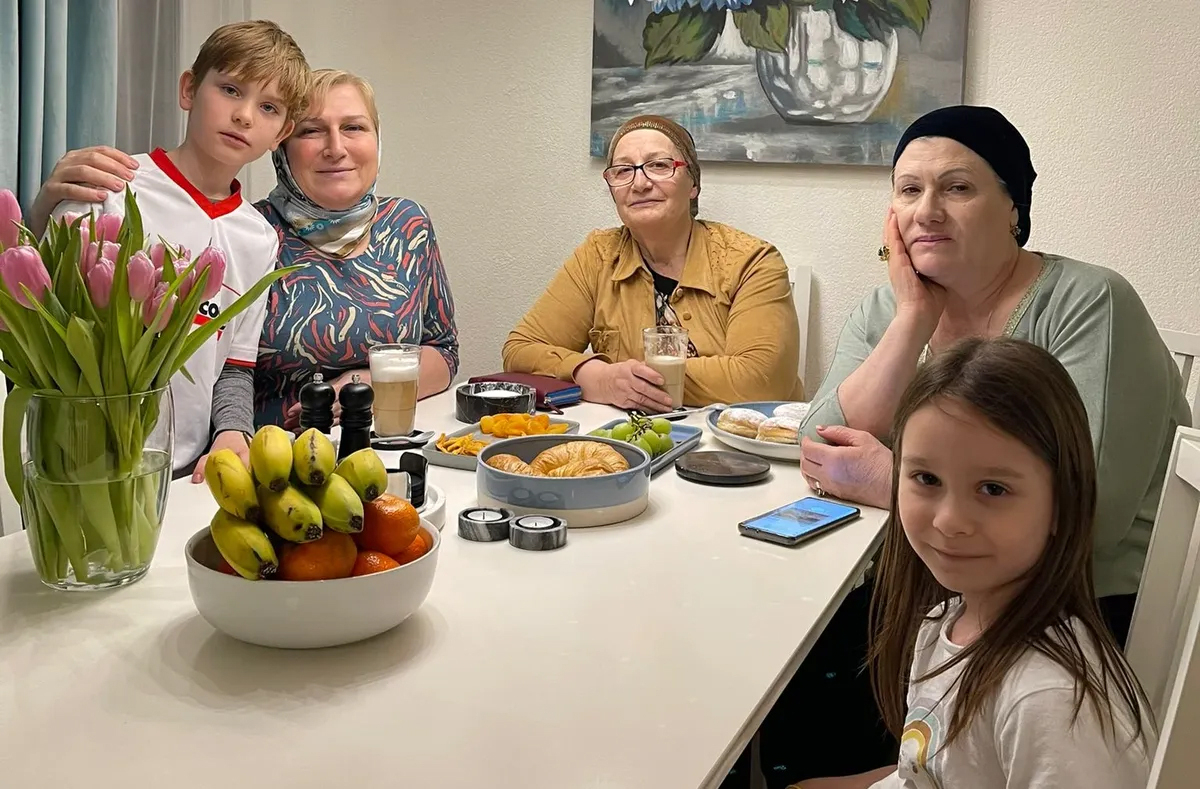 Zainap with her grandchildren and the friends who helped smuggle Slava to safety. Photo courtesy of Zainap Gashaeva.