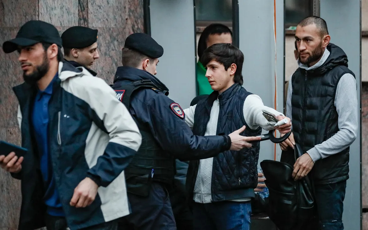 Police stop and search a young Muslim in Moscow, 10 April 2024. Photo: EPA-EFE / YURI KOCHETKOV