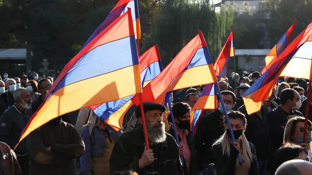 Protesters flying the Armenian flag at an opposition rally in Yerevan. Photo: EPA-EFE / STEPAN POGHOSYAVN /vPHOTOLURE&nbsp;