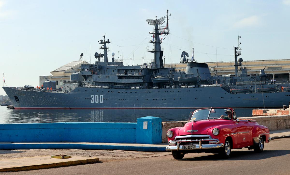 A car drives past a Russian naval frigate docked in Havana, Cuba, 27 July 2024. Photo: EPA / Ernesto Mastrascusa